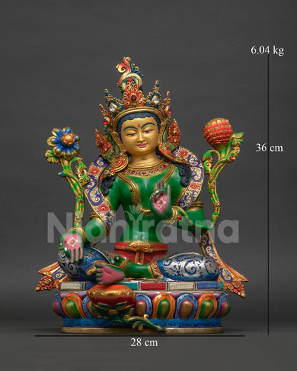 Green Tara Buddhist statue front view with gold painted face and multicolor robe