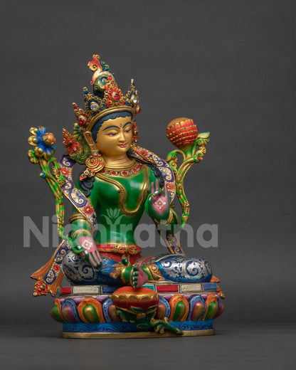 Green Tara Buddhist statue right view side showing colorful robe and ornate craftsmanship