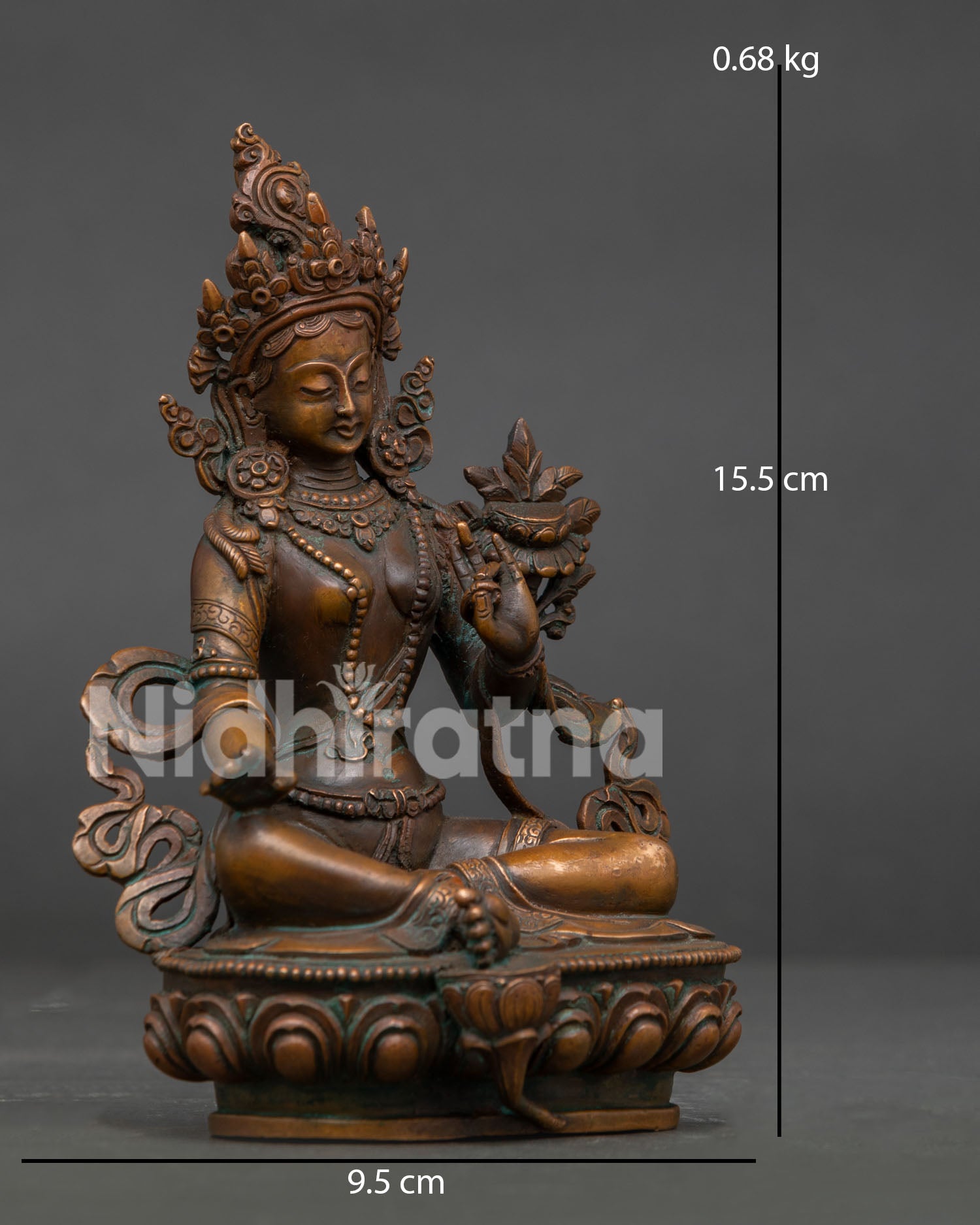 Green Tara Buddhist statue seated on lotus pedestal with Varada and Abhaya Mudra.