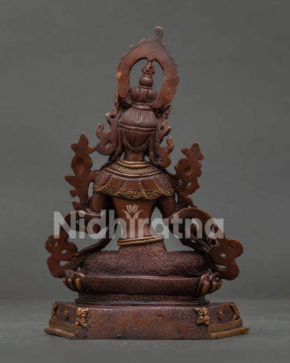 Green Tara Buddhist statue showcasing traditional Nepalese metal sculpture.