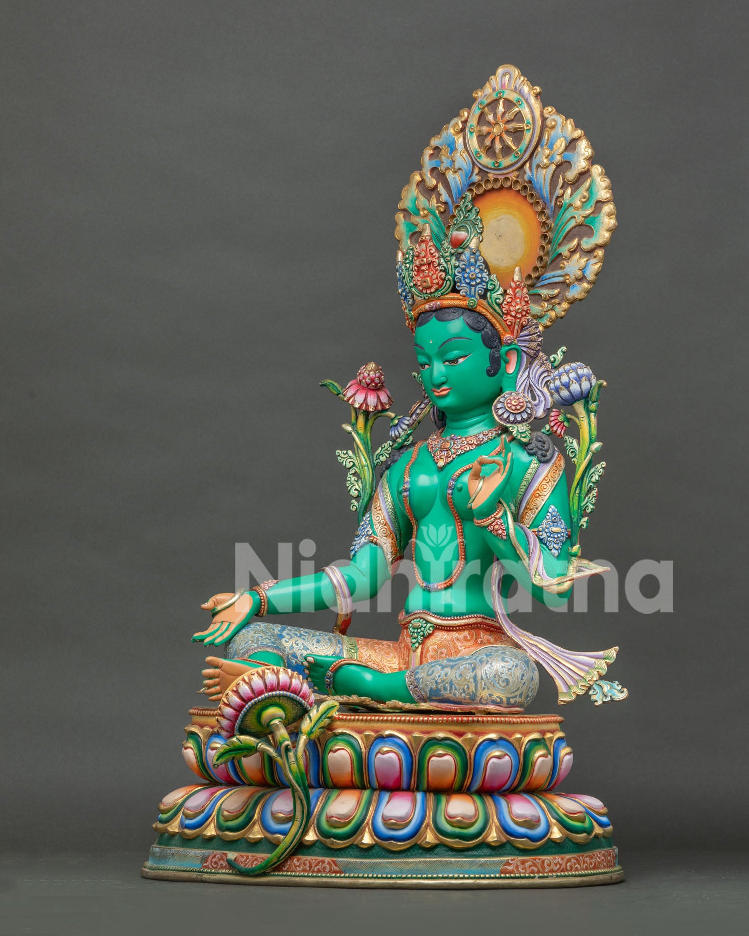 Green Tara Buddhist statue with Dharma Wheel halo, handcrafted Newari sculpture