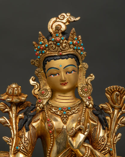 Green Tara Buddhist statue with gold painted face and semi precious stone inlays