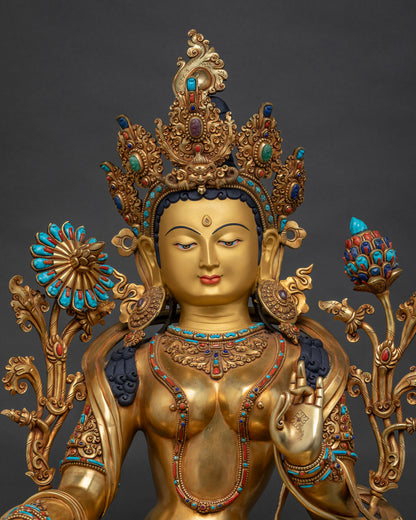 Green Tara copper statue close-up — gold-gilded body, turquoise & coral inlays, Newari craftsmanship