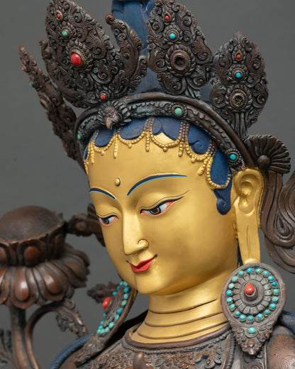 Green Tara face side profile—handmade copper statue with gold details & spiritual mudra pose