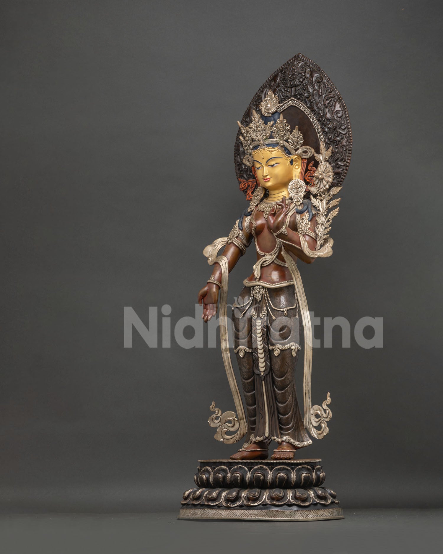 Green Tara left side view—handcrafted oxidized copper statue showing ornate jewelry & details