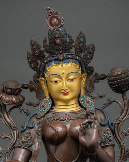 Green Tara meditation statue detail—handcrafted copper figurine with semi-precious stone inlays