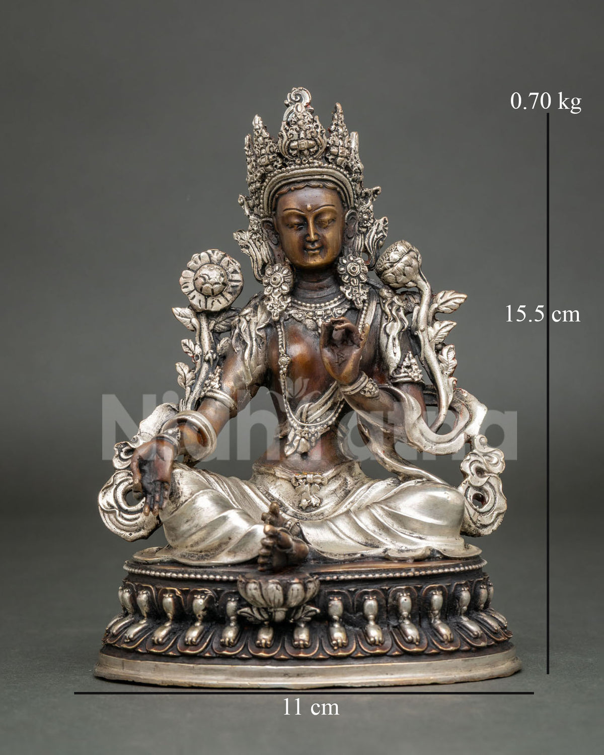 Green Tara meditation statue in oxidized copper with silver-plated details, front view on lotus base