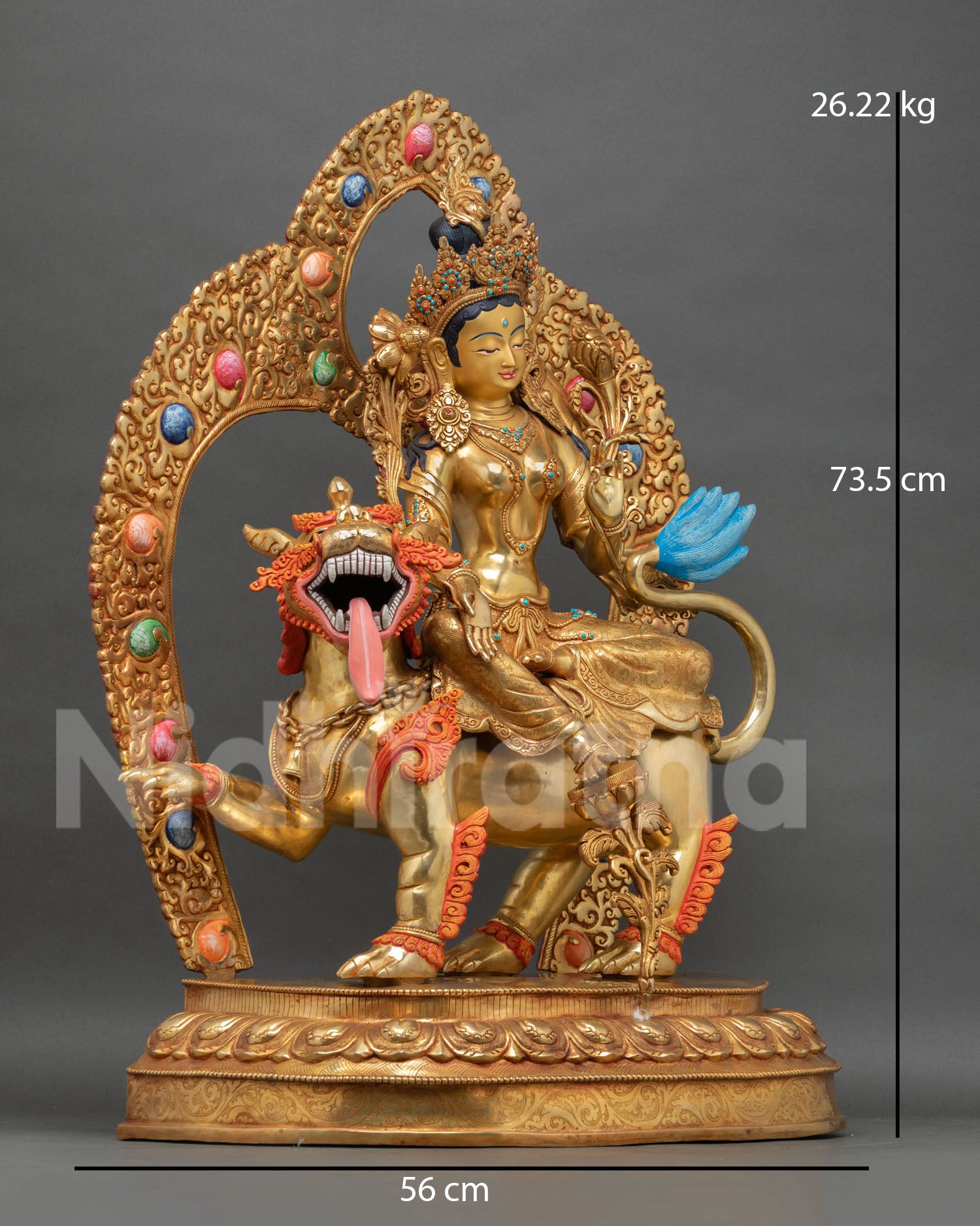 Green Tara sculpture side view Himalayan Buddhist art with ornate carvings floating robes and varada mudra posture