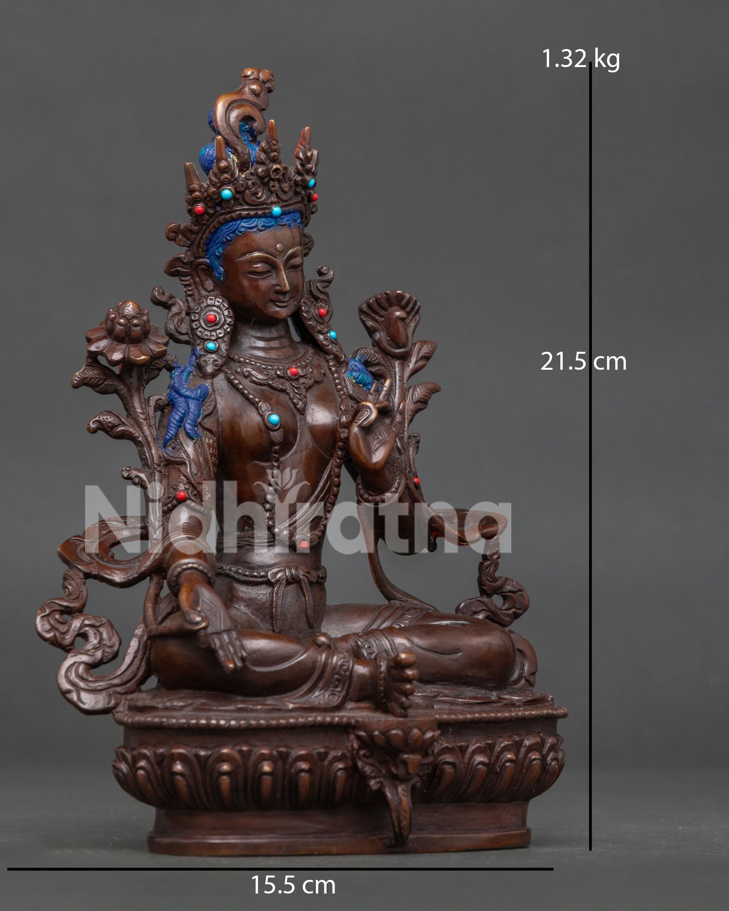 Green Tara seated gracefully on a lotus pedestal with ornate sacred jewelry
