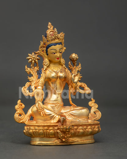 Green Tara seated in lalitasana on hand carved lotus pedestal with right leg resting on lotus.