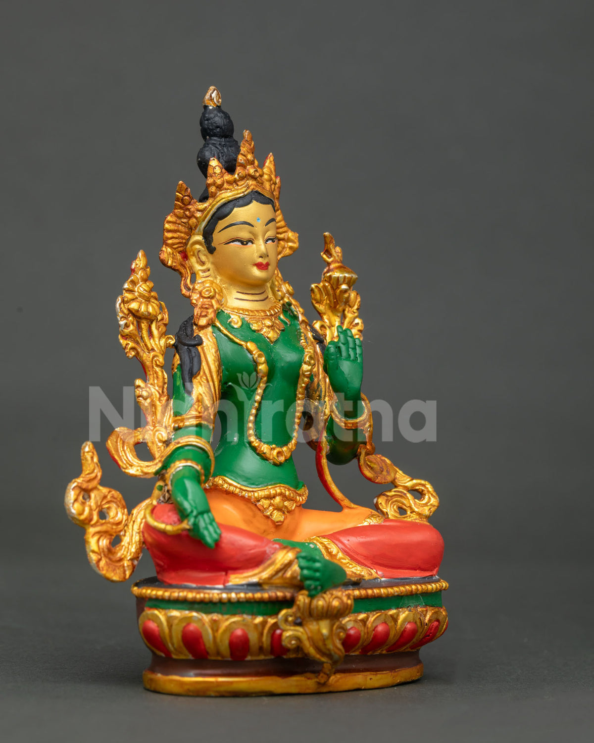 Green Tara seated on hand carved lotus pedestal.