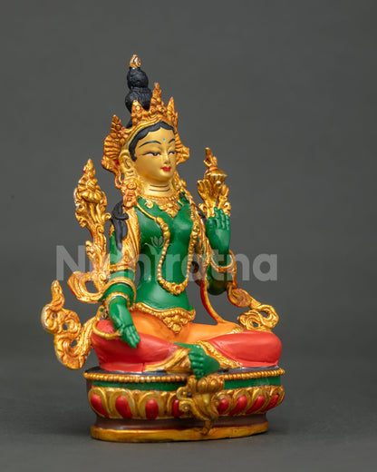Green Tara seated on hand carved lotus pedestal.
