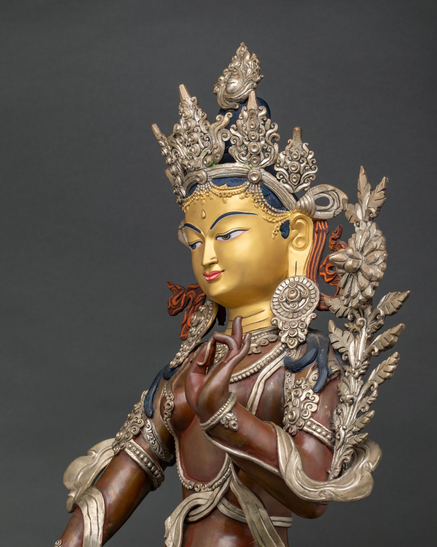 Green Tara side view—handcrafted oxidized copper statue showing detailed jewelry & garments