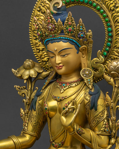 Green Tara side view: ornate jewelry, protective mudra, flame-like golden halo detail
