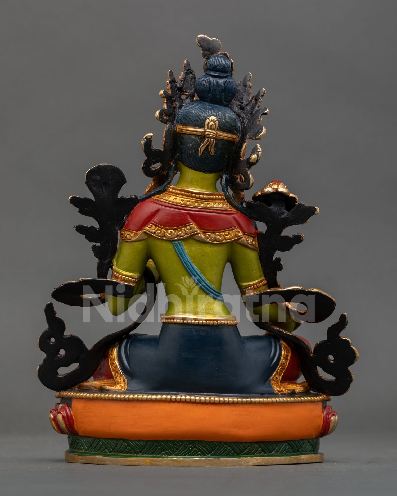 green tara statue back view detailed copper craftsmanship engraved lotus pedestal sacred buddhist art nepal