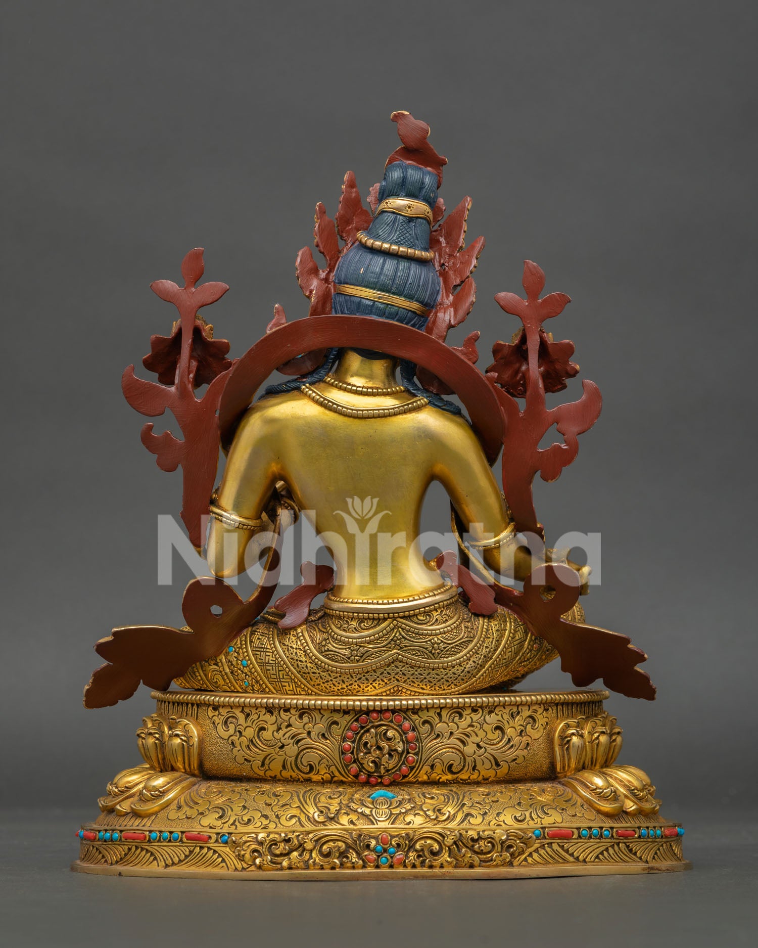 green tara statue back view detailed lotus throne floral carving nepal art