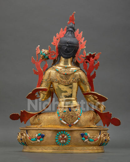 Green Tara statue back view displaying detailed copper carving, lost wax casting craftsmanship, and sacred Nepalese altar decor artistry.