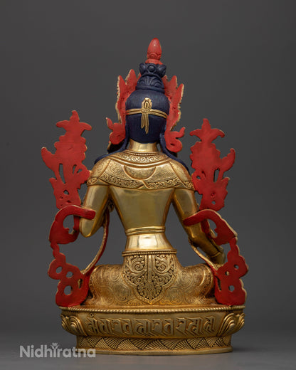Green Tara statue back view Newari copper sculpture gold gilded floral carved details.