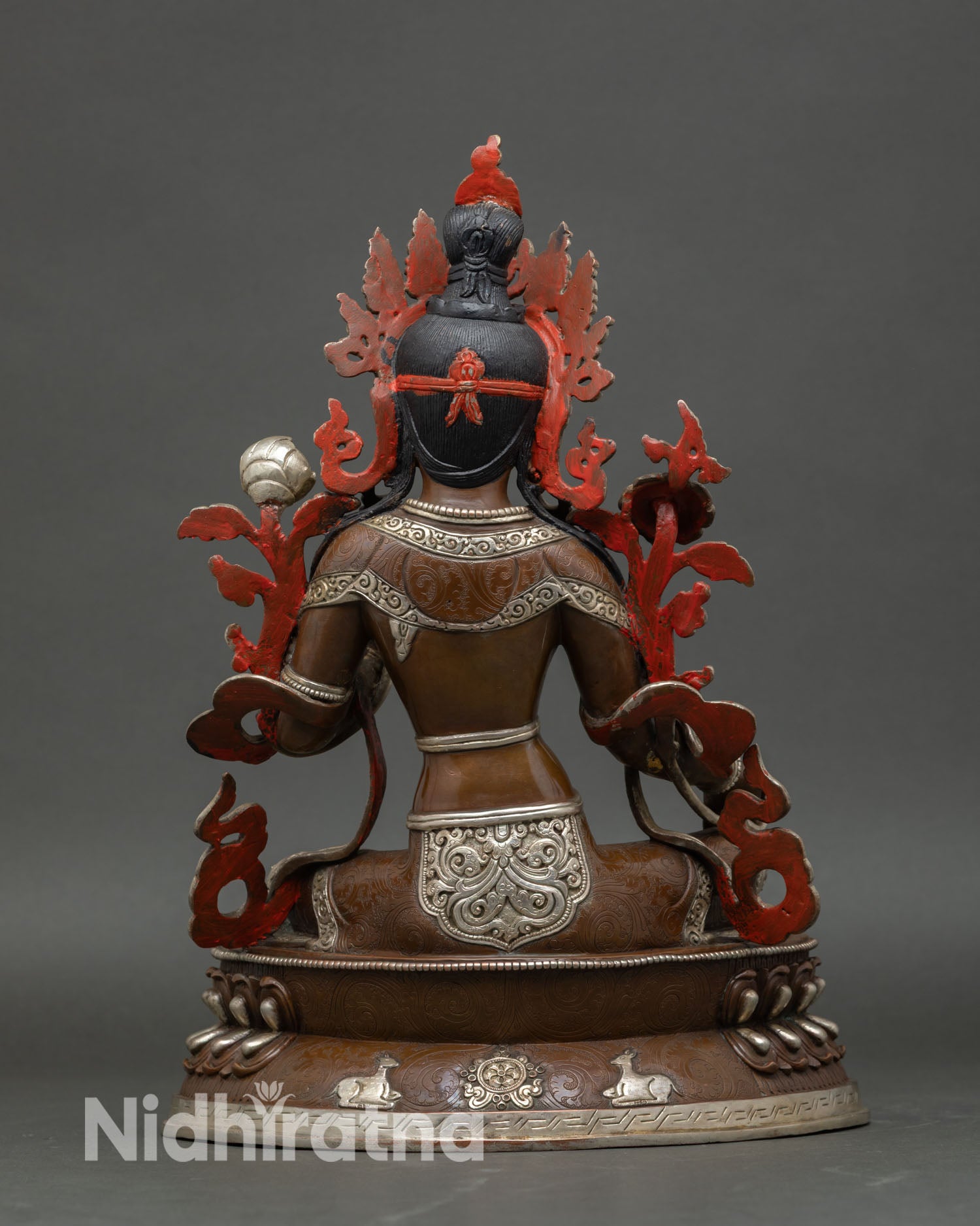 Green Tara statue back view ornate silver plated craftsmanship Himalayan Buddhist artwork Patan Nepal
