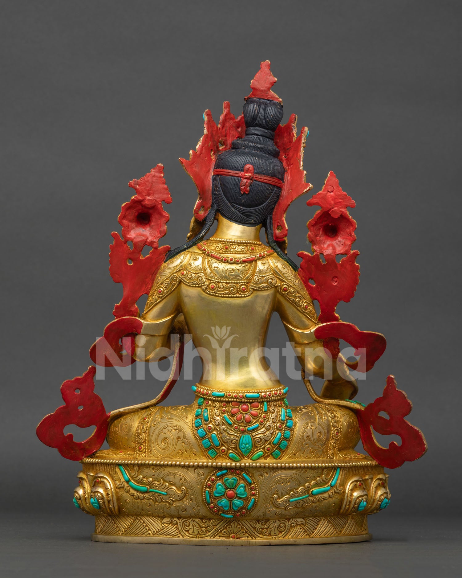 Back view of Green Tara statue Sri Lanka with sacred mantra inlaid in turquoise on lotus seat