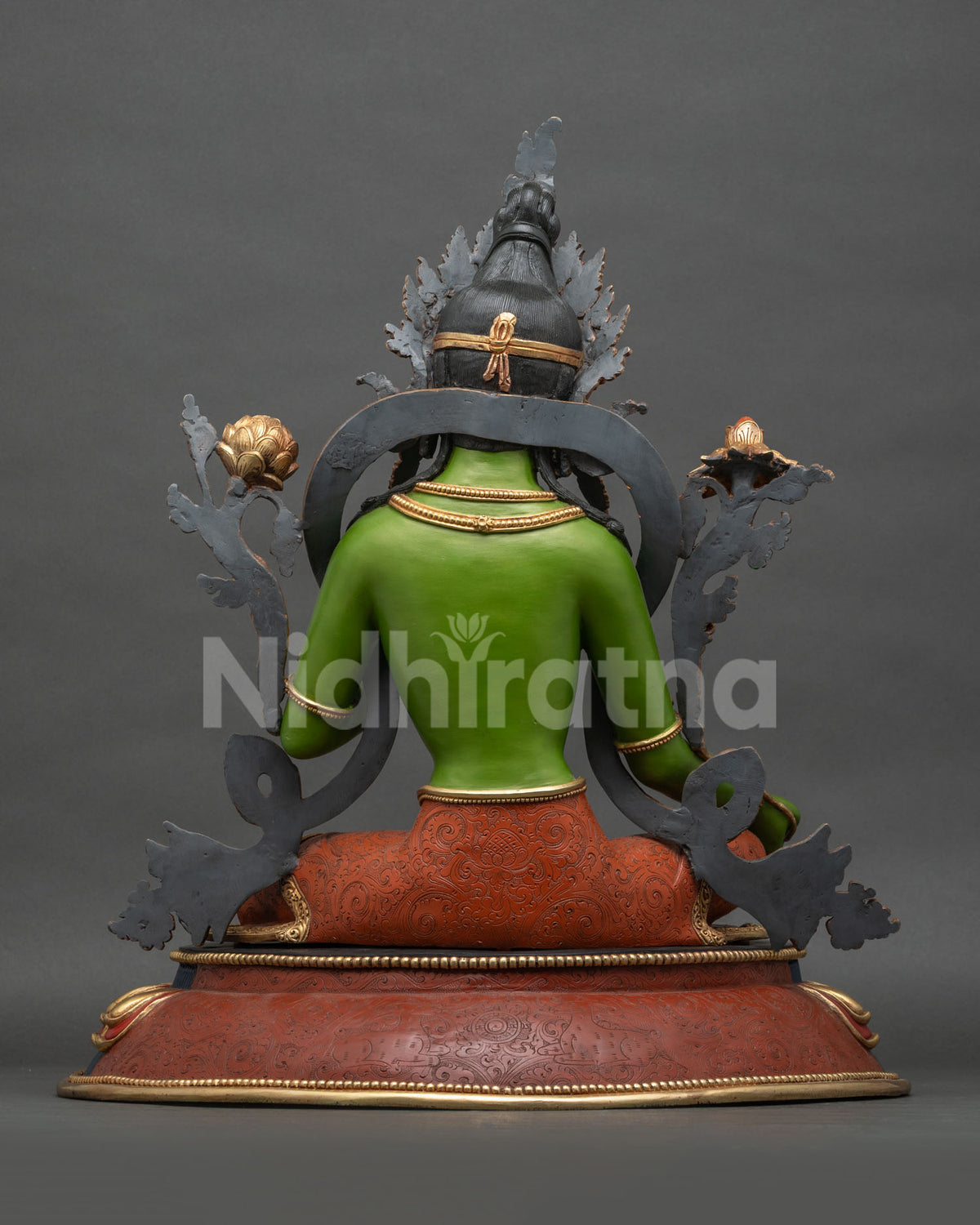 Green Tara statue back view showing copper casting and gold-gilded details, handmade in Nepal
