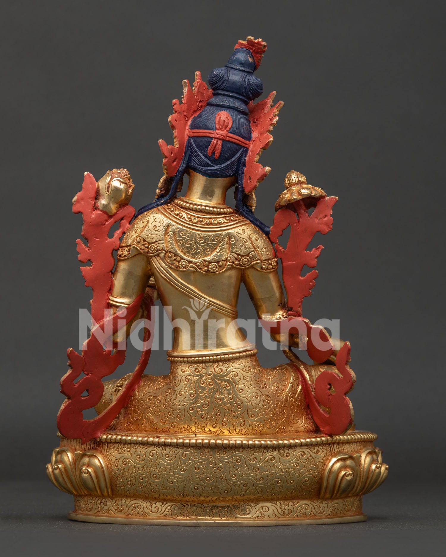 Green Tara statue back view showing hand carved garment and traditional Newari craftsmanship.