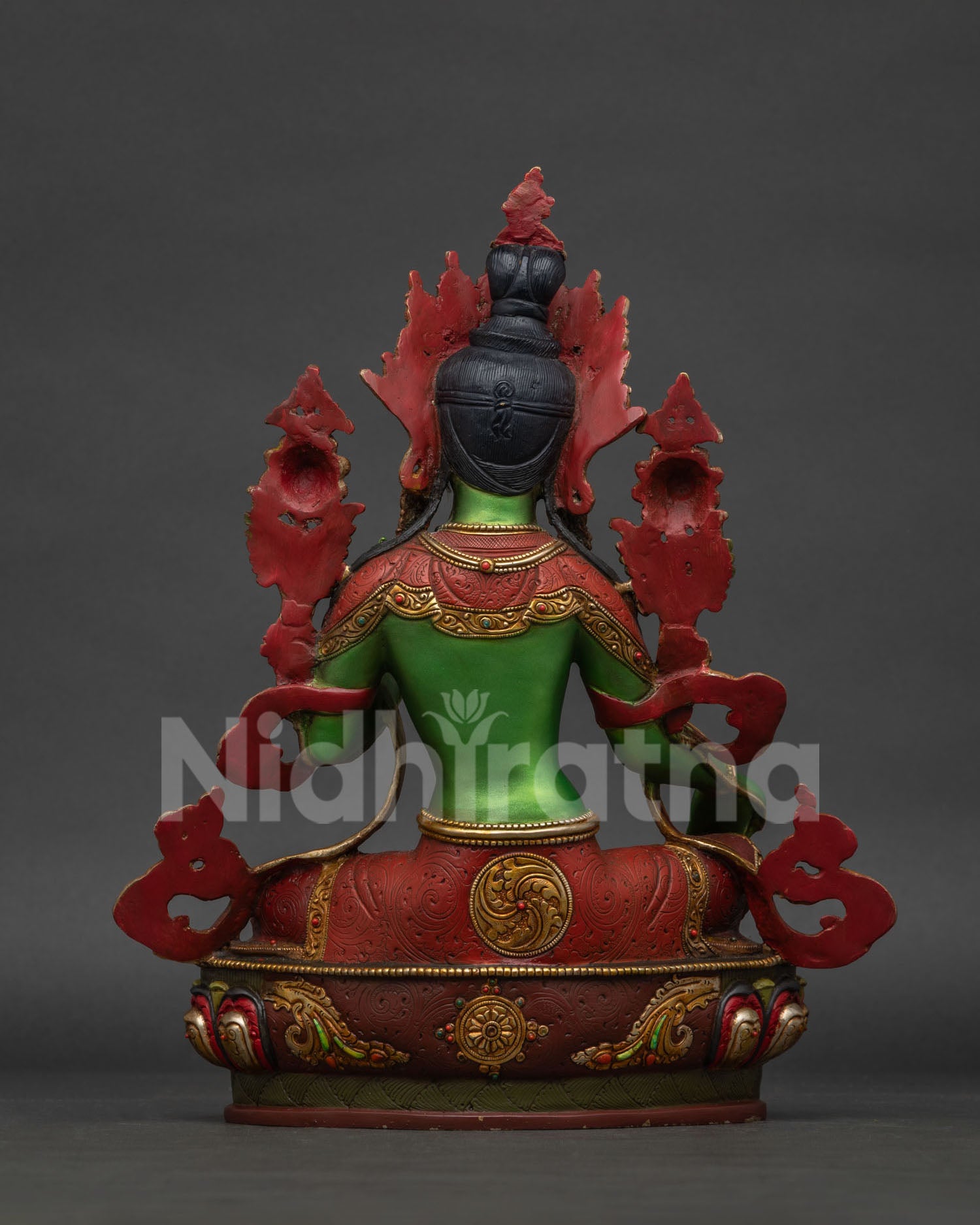 Green Tara statue back view, showing lotus throne and gold detailing