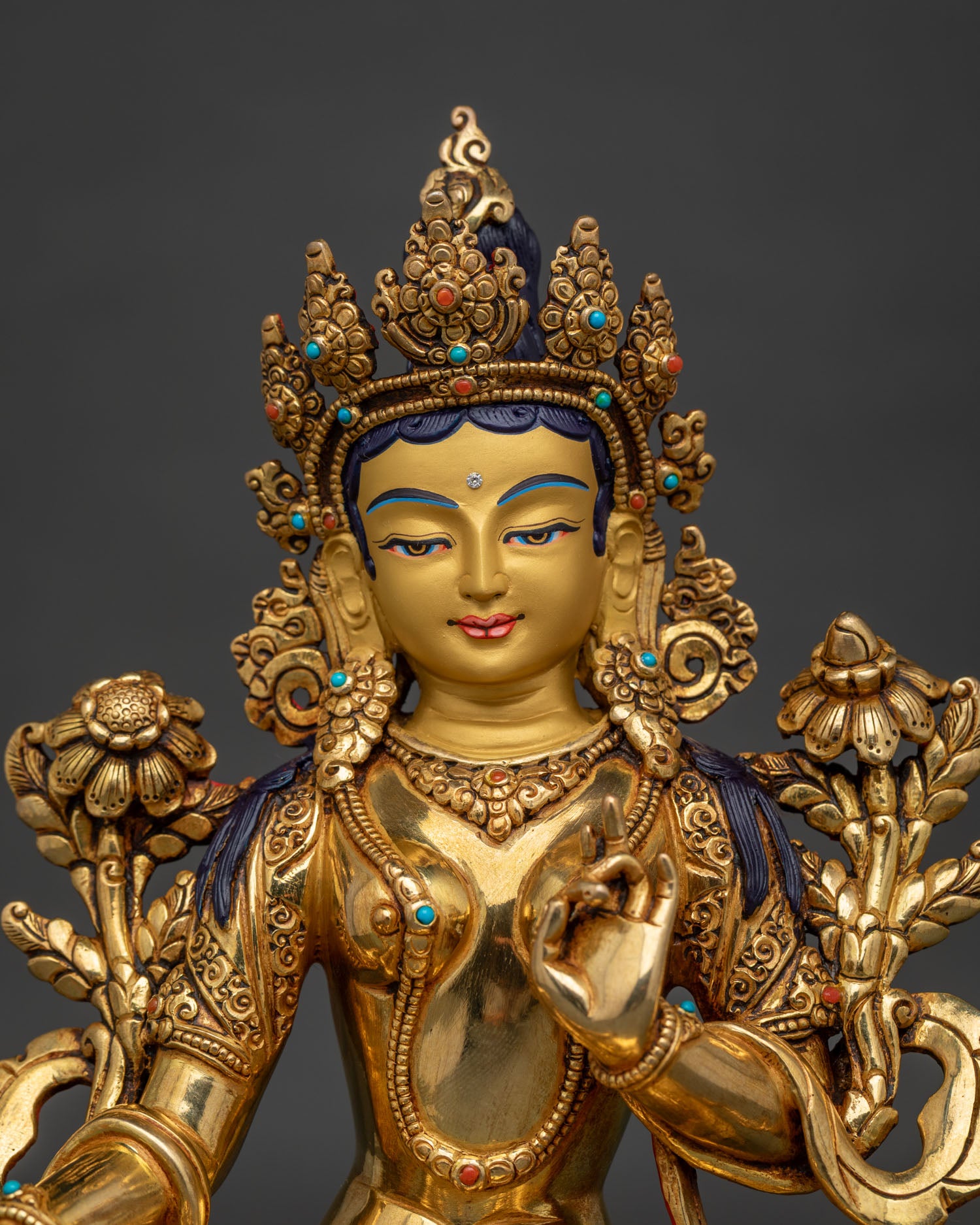 Green Tara Statue Close Up 24K Gold Painted Face Ornate Crown and Buddhist Jewelry.
