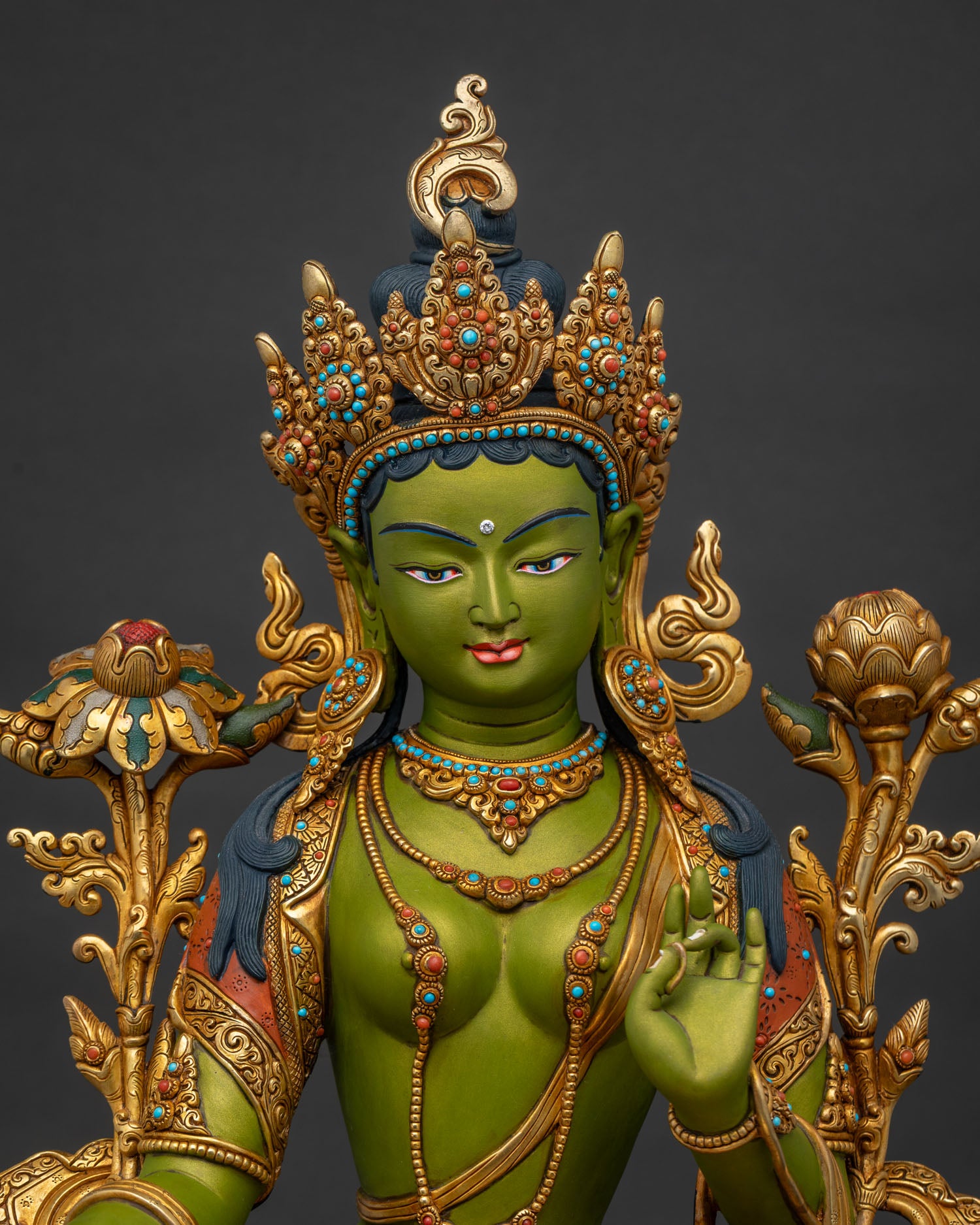 Green Tara statue close-up – hand-painted gold-gilded copper Buddhist deity detail