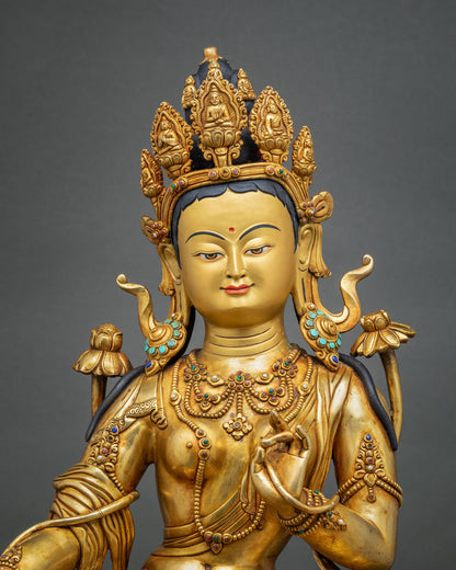 Green Tara statue close-up of face, five-point crown and gemstone jewelry, handcrafted in Nepal