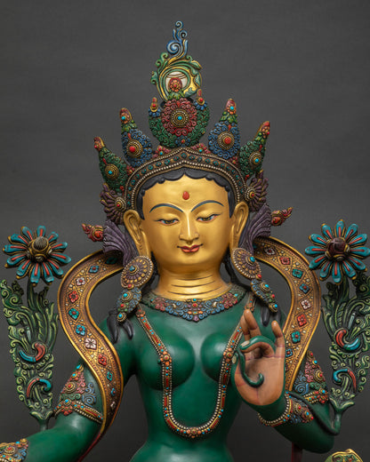 Green Tara Statue close up, Varada mudra hand and ornate jewelry detail