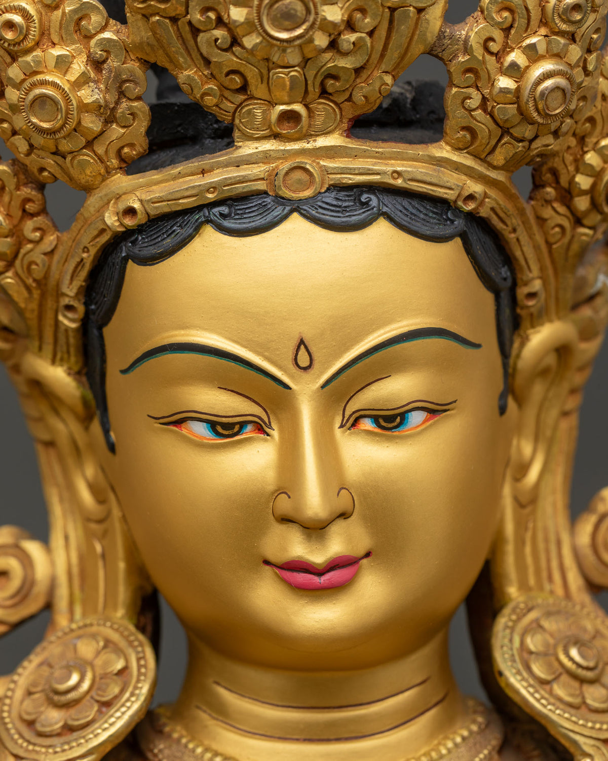 Green Tara Statue Face Close Up, Detailed Serene Expression Copper Sculpture