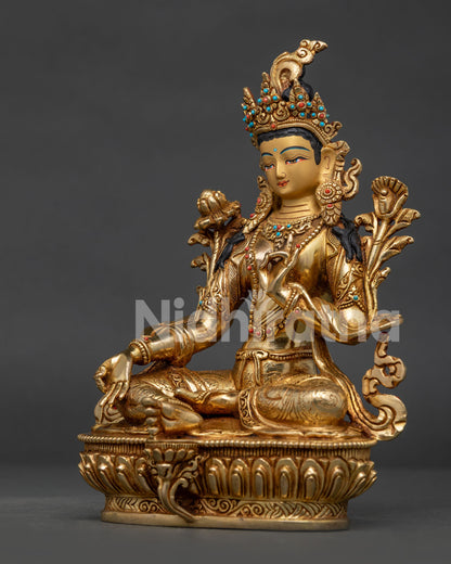 Green Tara statue face showing Newari craftsmanship and Himalayan Buddhist art.