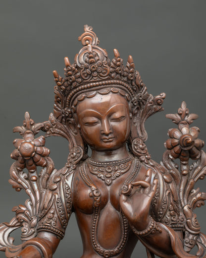 Green Tara statue five jewel crown layered necklaces floral garment.