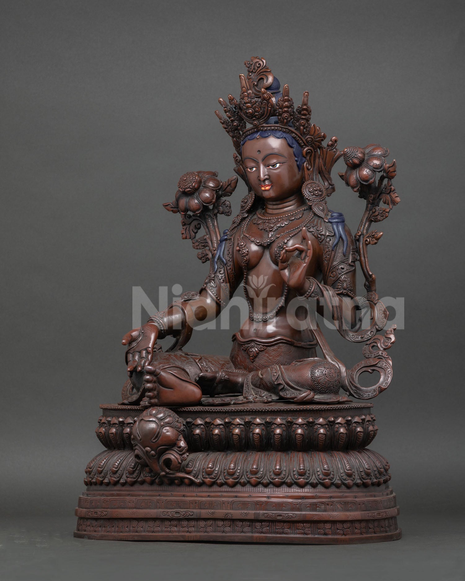 Green Tara statue ,flowing robes, detailed lotus base, traditional Nepalese Buddhist craftsmanship