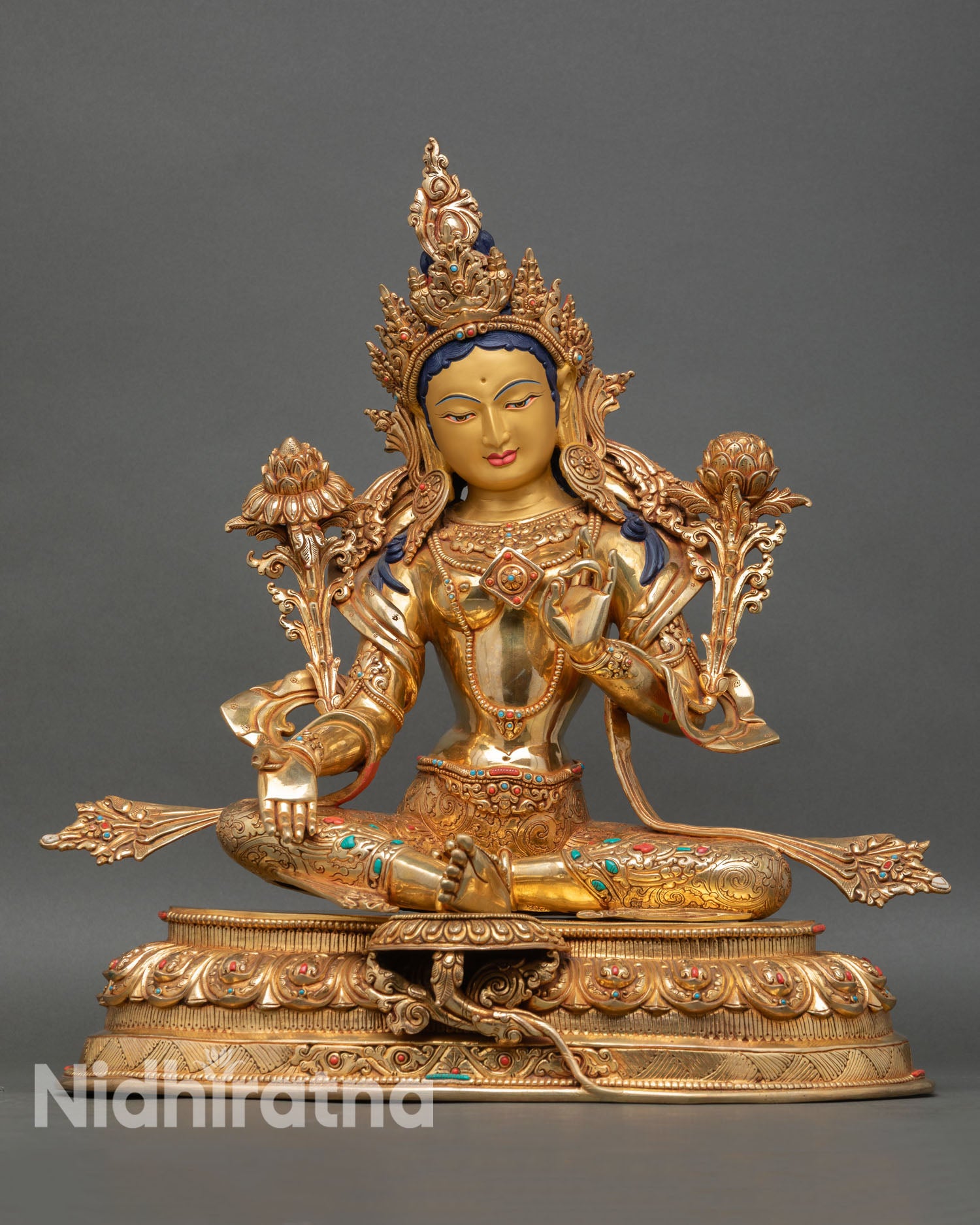 Green Tara statue front view handcrafted in Nepal copper gold gilded Buddhist art with varada mudra and lotus seat with semi precious gemstones