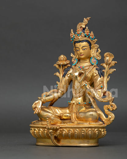 Green Tara statue handcrafted by Newari artisan from Patan Nepal with gold gilded copper finish and 24k gold painted face.