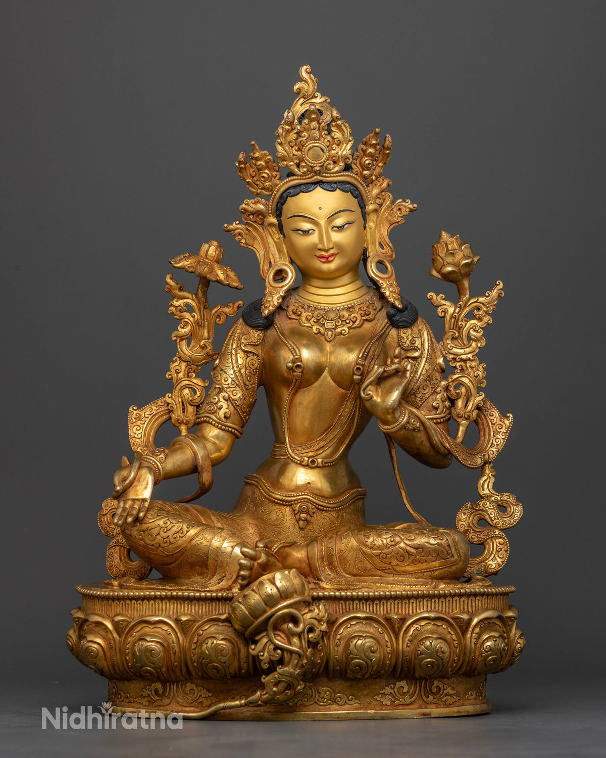 Green Tara statue handcrafted by Newari artisans from Nepal with gold fire gilding.