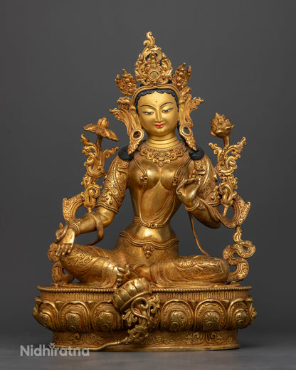 Green Tara statue handcrafted by Newari artisans from Nepal with gold fire gilding.