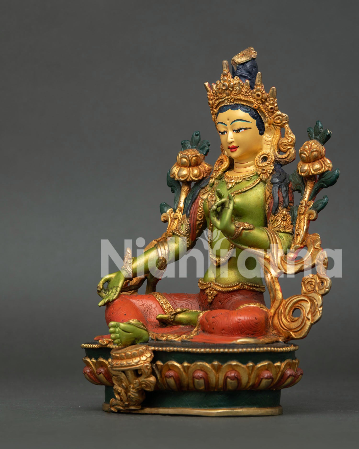 Green Tara statue handcrafted in Nepal from copper with gold gilded body and gold painted face, seated on lotus throne in sacred Buddhist art style.