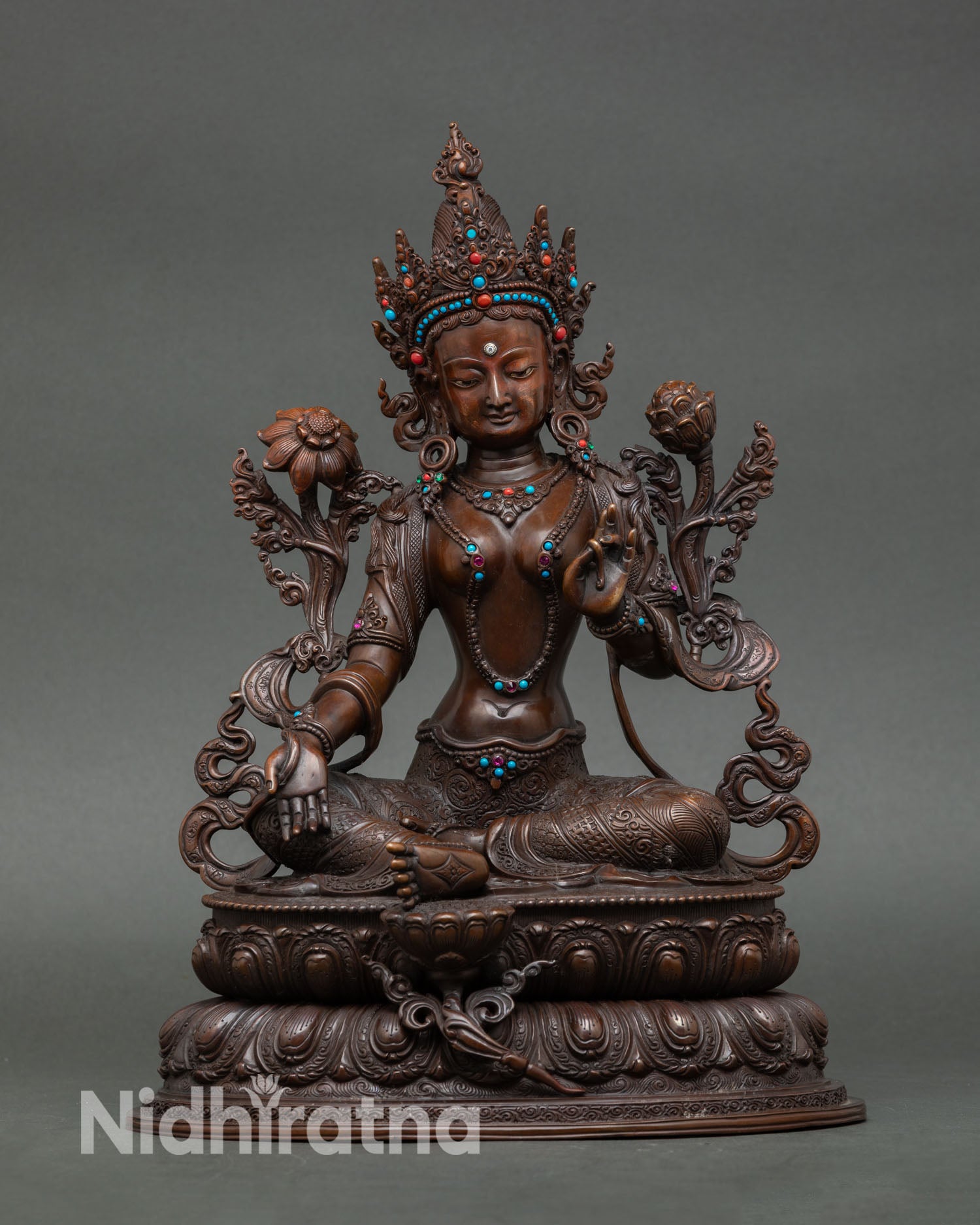 Green tara statue handcrafted in Nepal oxidized copper Buddhist goddess of compassion seated on double lotus throne holding utpala flower