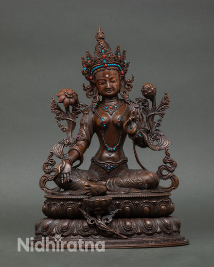 Green tara statue handcrafted in Nepal oxidized copper Buddhist goddess of compassion seated on double lotus throne holding utpala flower