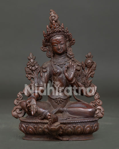 Green Tara Statue handcrafted in Nepal with oxidized copper finish seated on lotus throne.