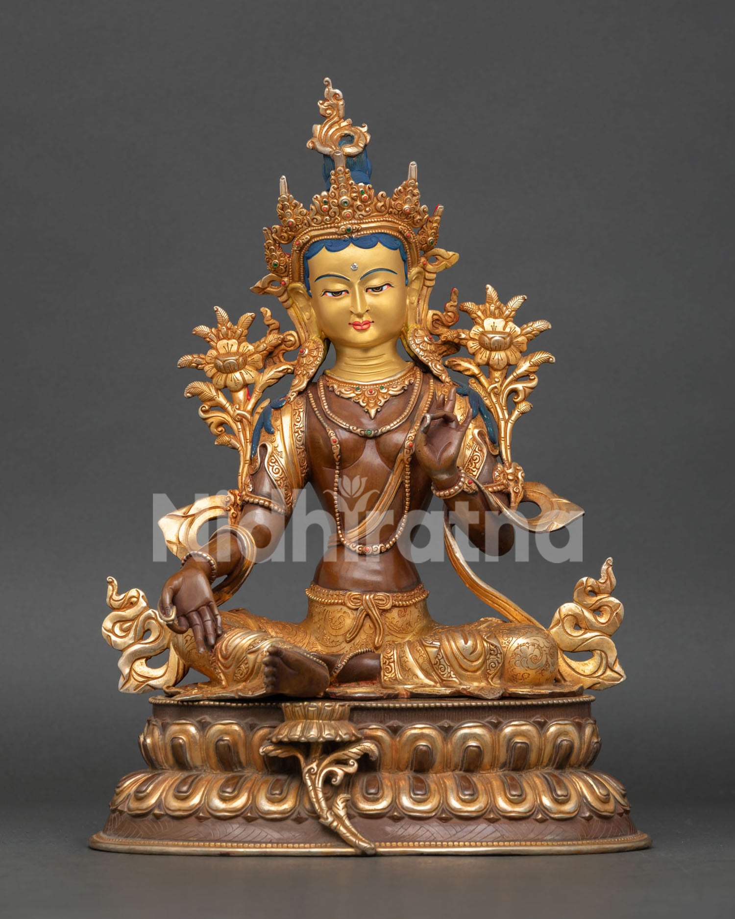 green tara statue handmade in nepal with 24k gold painted face and copper body