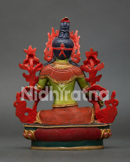 Green Tara statue highlighting intricate copper workmanship, vibrant acrylic colors, and gold gilded finish by skilled Nepalese artisans.