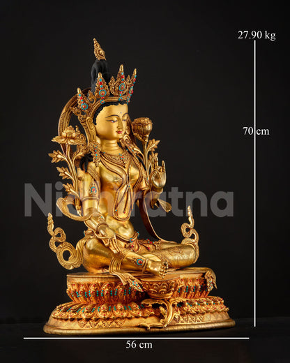 Green Tara statue holding utpala lotus stem with right hand in Varada Mudra and left hand in Abhaya Mudra blessing gesture