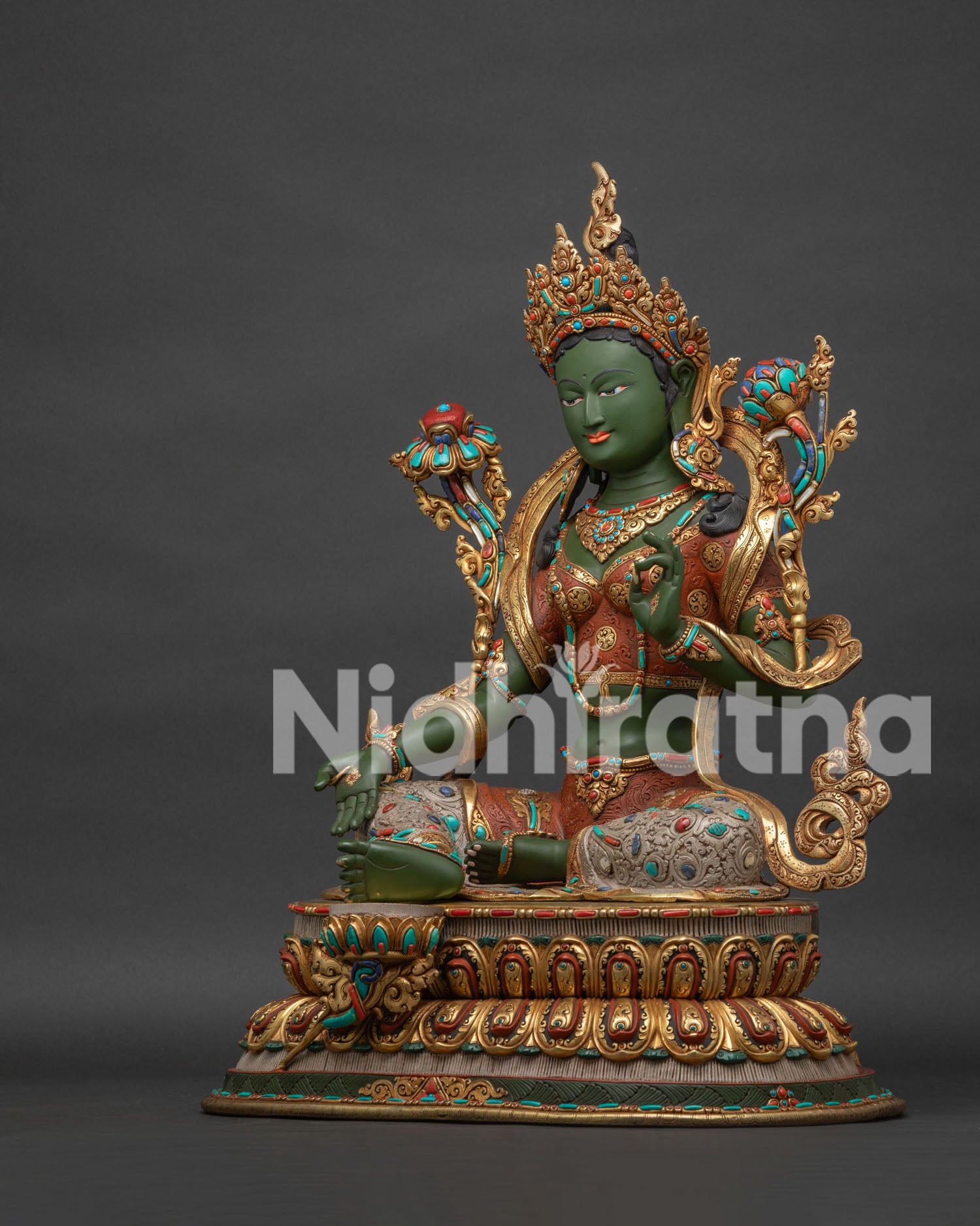 Green Tara statue left side view showing lotus throne and base