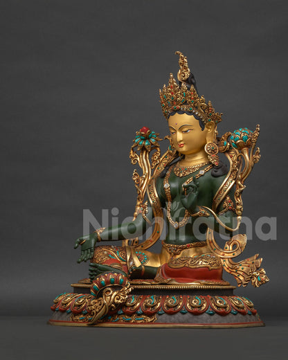 Green Tara statue left side view with extended Varada mudra hand blessing posture