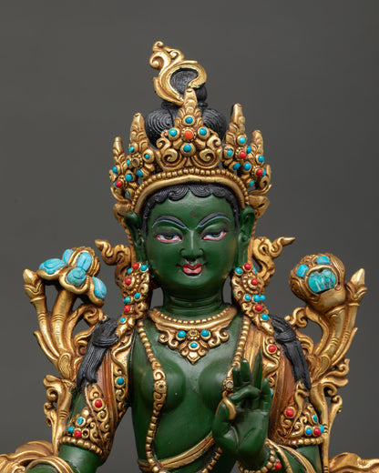 Green Tara statue embodying swift compassion, protection, fearlessness, and liberation from obstacles.