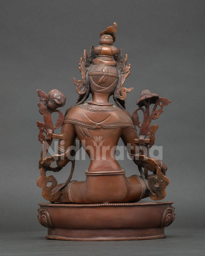 Green Tara Statue on lotus seat with oxidized copper finish handcrafted in Patan Nepal.